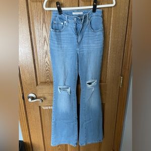 Levi jeans size 26 ripped and flared